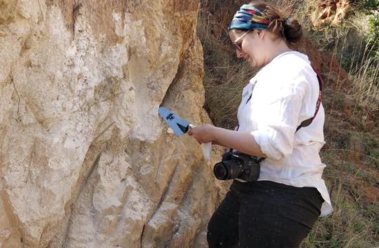 University of Missouri scientist Brandi L. MacDonald collects ochre and clay raw materials in Eswatini, southern Africa, for the study.